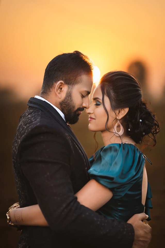 Couple embracing in warm sunset light