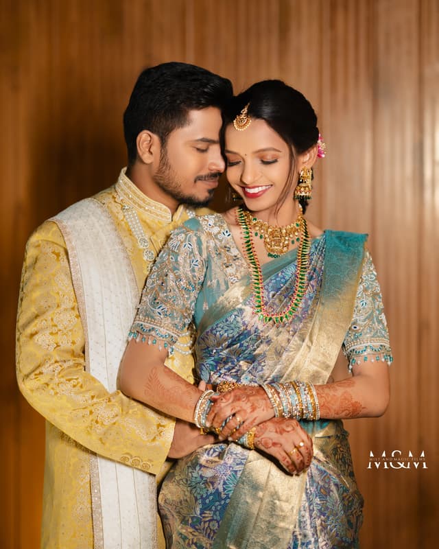 Engaged couple holding hands in coordinated formal outfits
