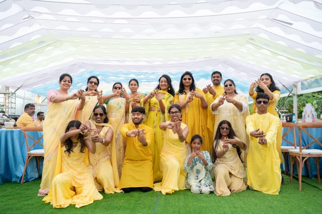 Haldi group portrait with family dressed in yellow
