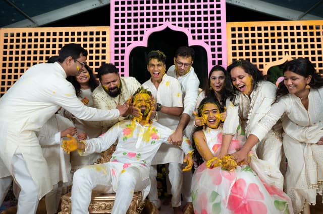 Family gathered closely around the couple during Haldi