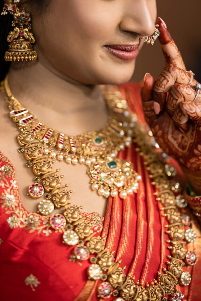 Close detail of bridal jewelry and henna during Pellikuthuru